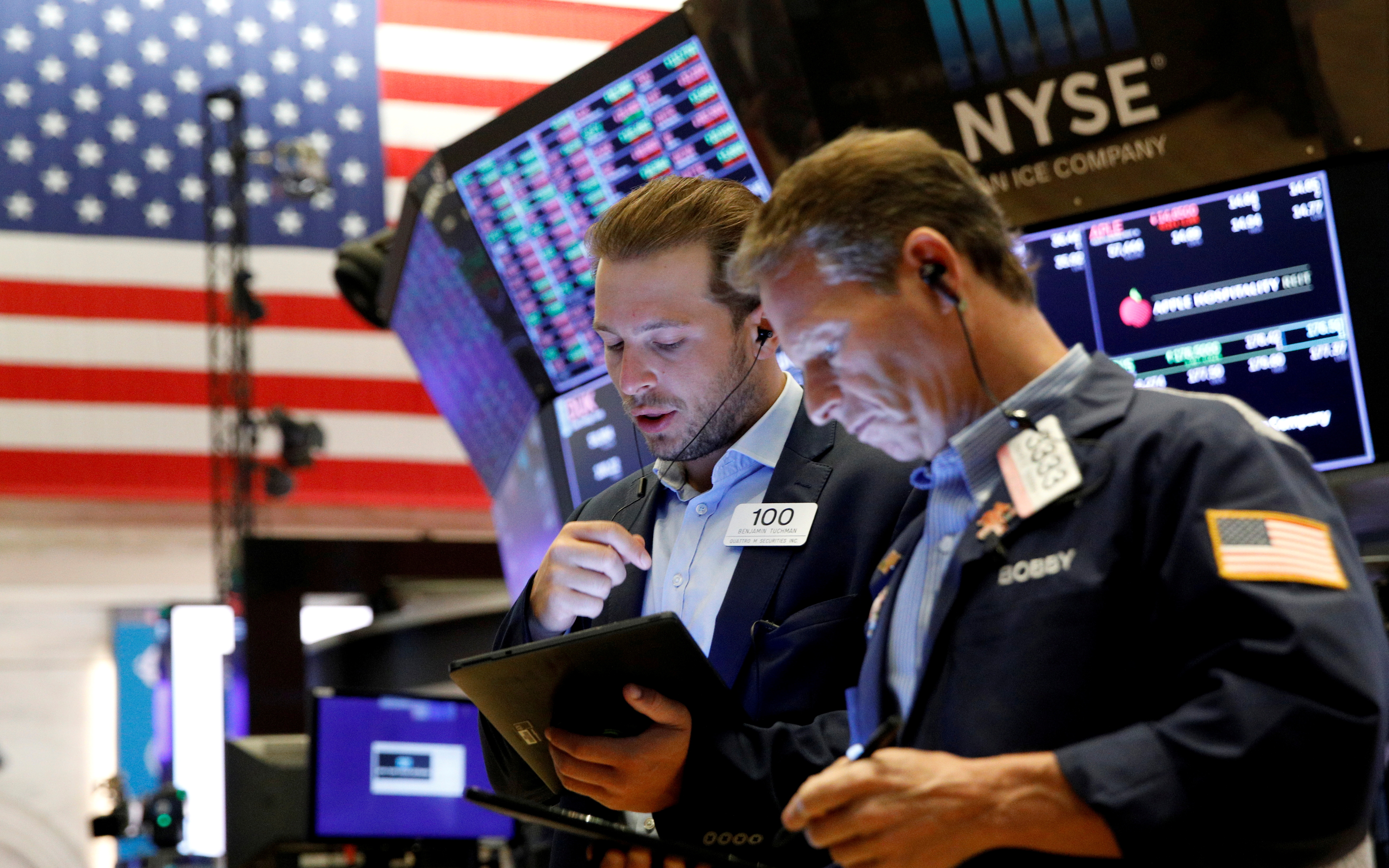 Traders actively working on the floor at the New York Stock Exchange (NYSE) in New York City.
Image Source: Reuters
