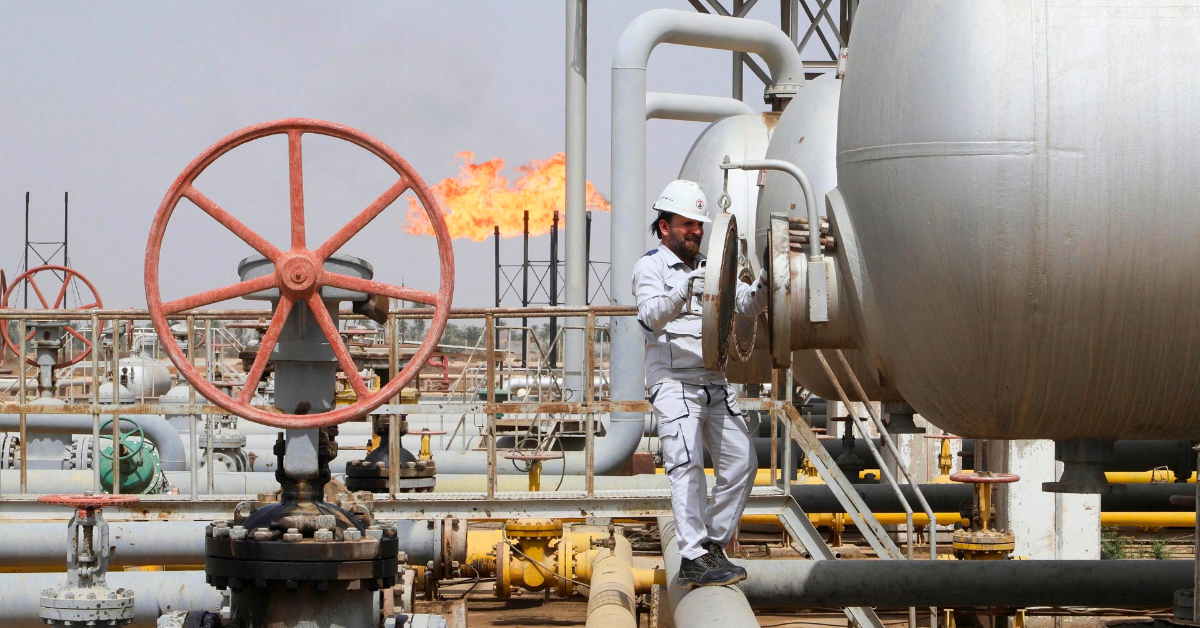A worker inspects a tank at the Nahr Bin Umar oil field, north of Basra, Iraq, March 22, 2022.
Image Source: Reuters